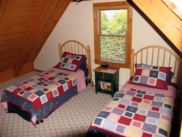 Two twin beds in second upstairs bedroom